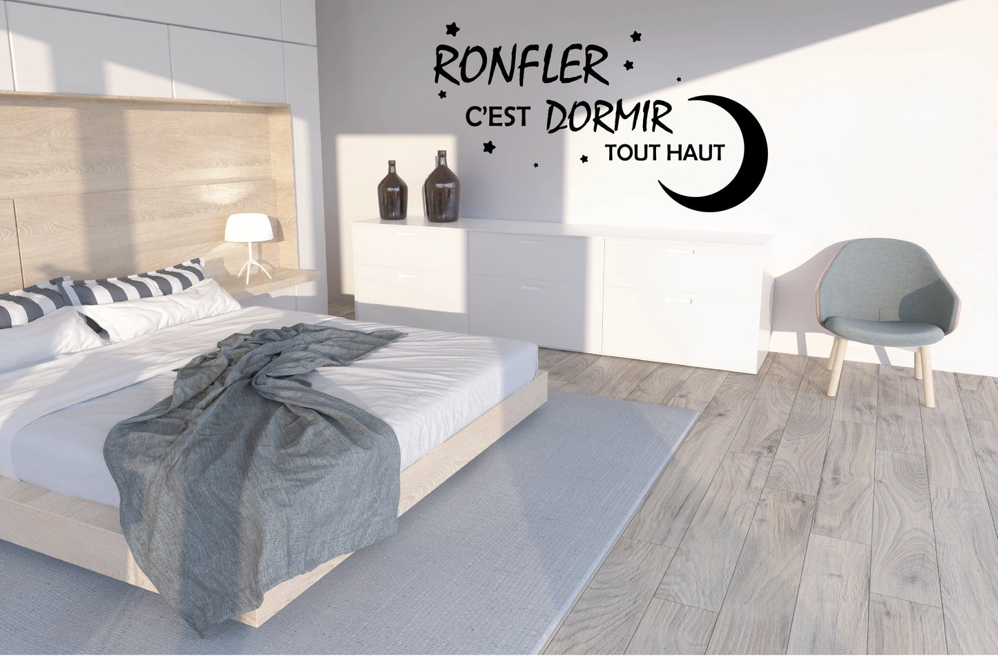 Chambre stylé avec la citation  'RONFLER c'est dormir tout haut' sur le mur.